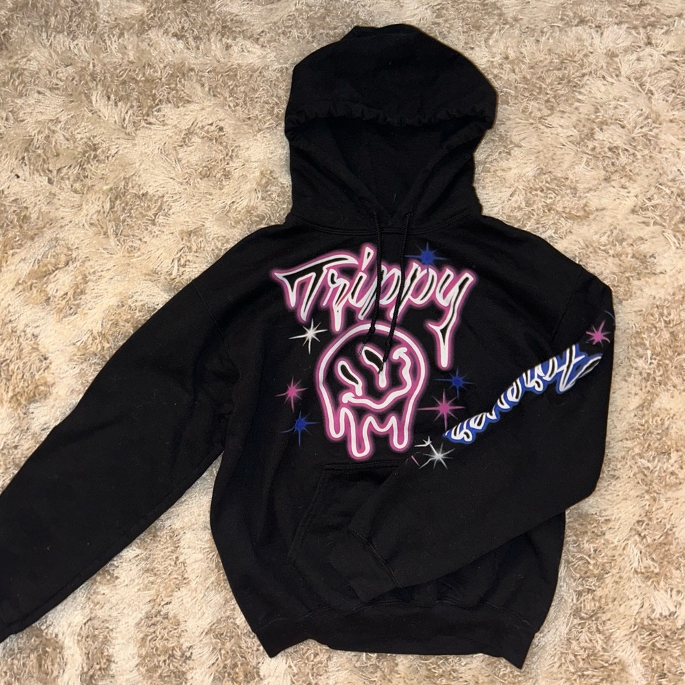 Black Hoodie with Neon “Trippy” lettering and smiley face.